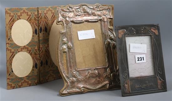 An Art Nouveau copper photo frame, an Arts & Crafts copper photo frame and a Liberty & Co fabric triptych photo frame